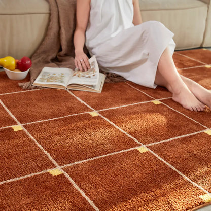 Tapis à carreaux marron facilement nettoyé à l’aspirateur, idéal pour un entretien simple et rapide.