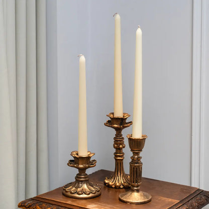 Trilogie de bougeoirs dorés – composition harmonieuse