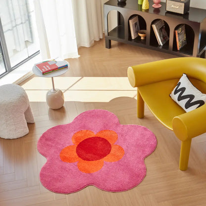 Tapis floral rose et orange en forme de fleur, apportant une touche douce et joyeuse à un salon moderne.
